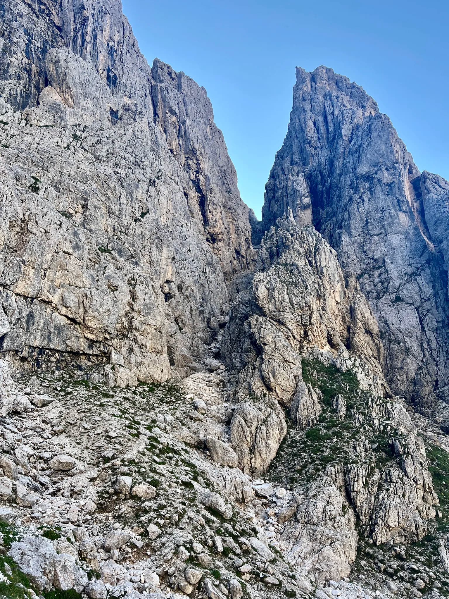 Steep rocky mountain peaks and scree slopes in the Pale di San Martino range.