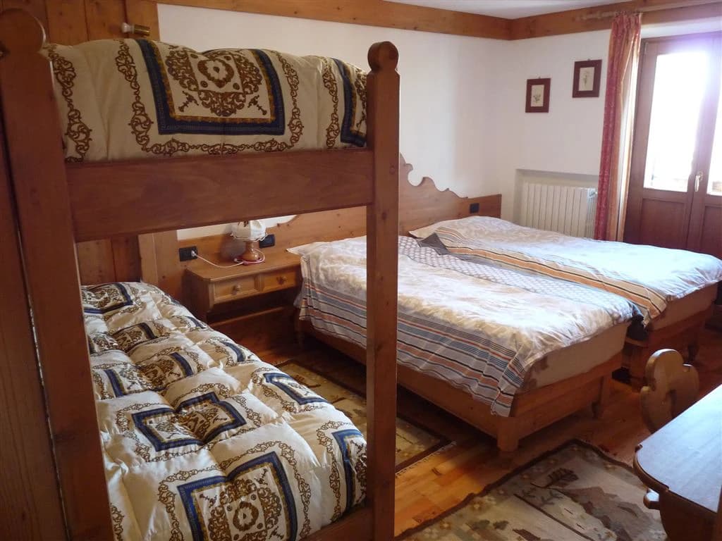 Wooden bedroom with bunk beds and two single beds, alpine style, Rifugio Duca D'Aosta