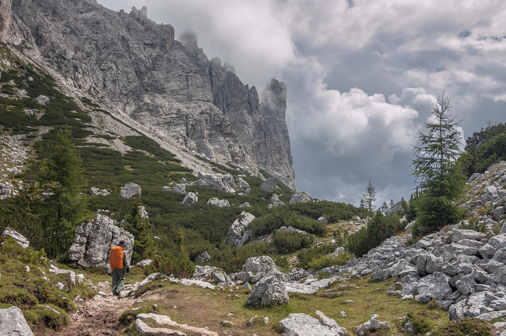 On trail from Coldai refuge via Coldai lake to Vazzoler refuge, along Civetta mountain range from north to south, stage 9 of Alta Via 1 classic long trek in the Dolomites, South Tirol, Italy.