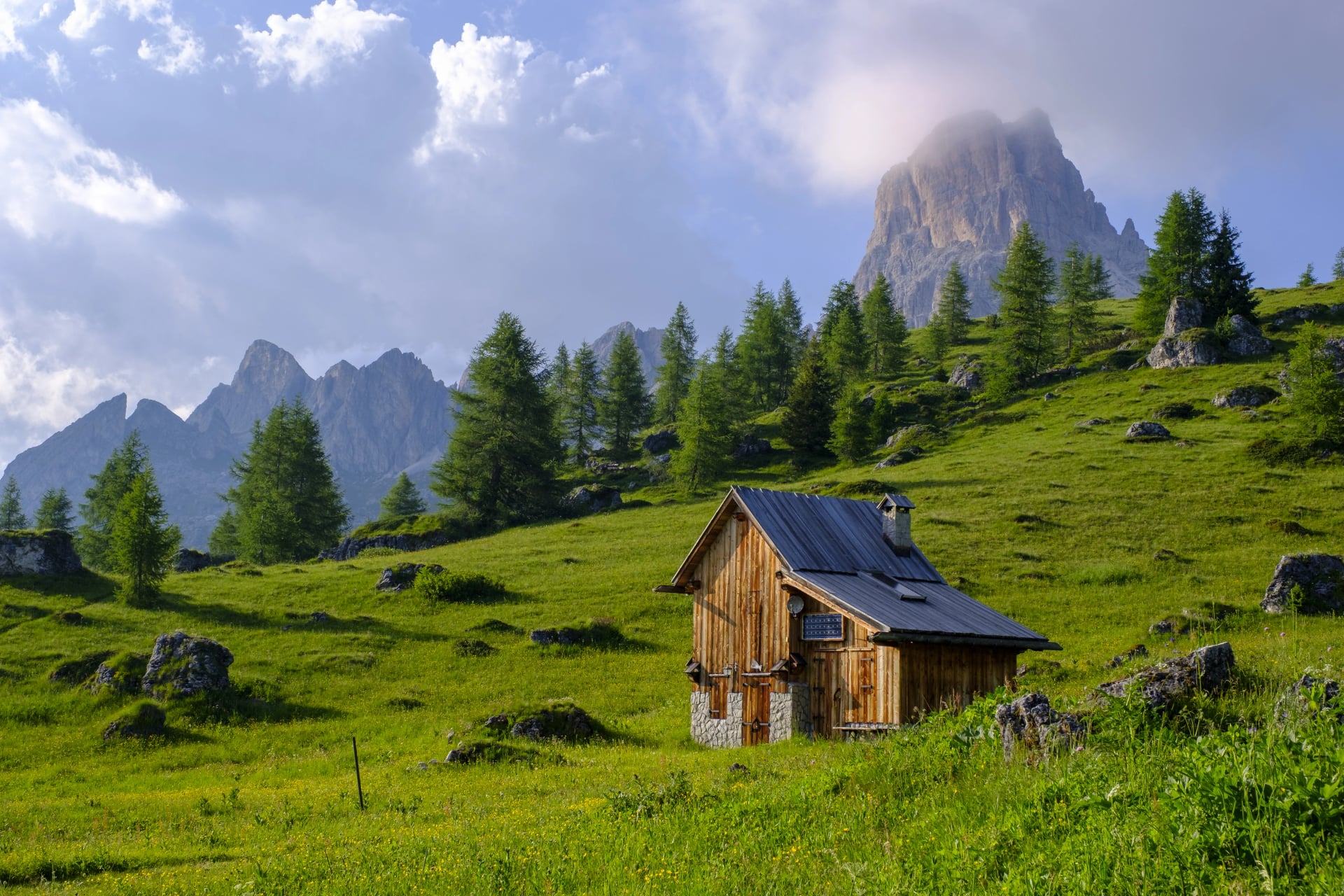 Hut in Passo Giau and mountain of Averau, hiking in the Alta via 1, in the Dolomites of Italy.