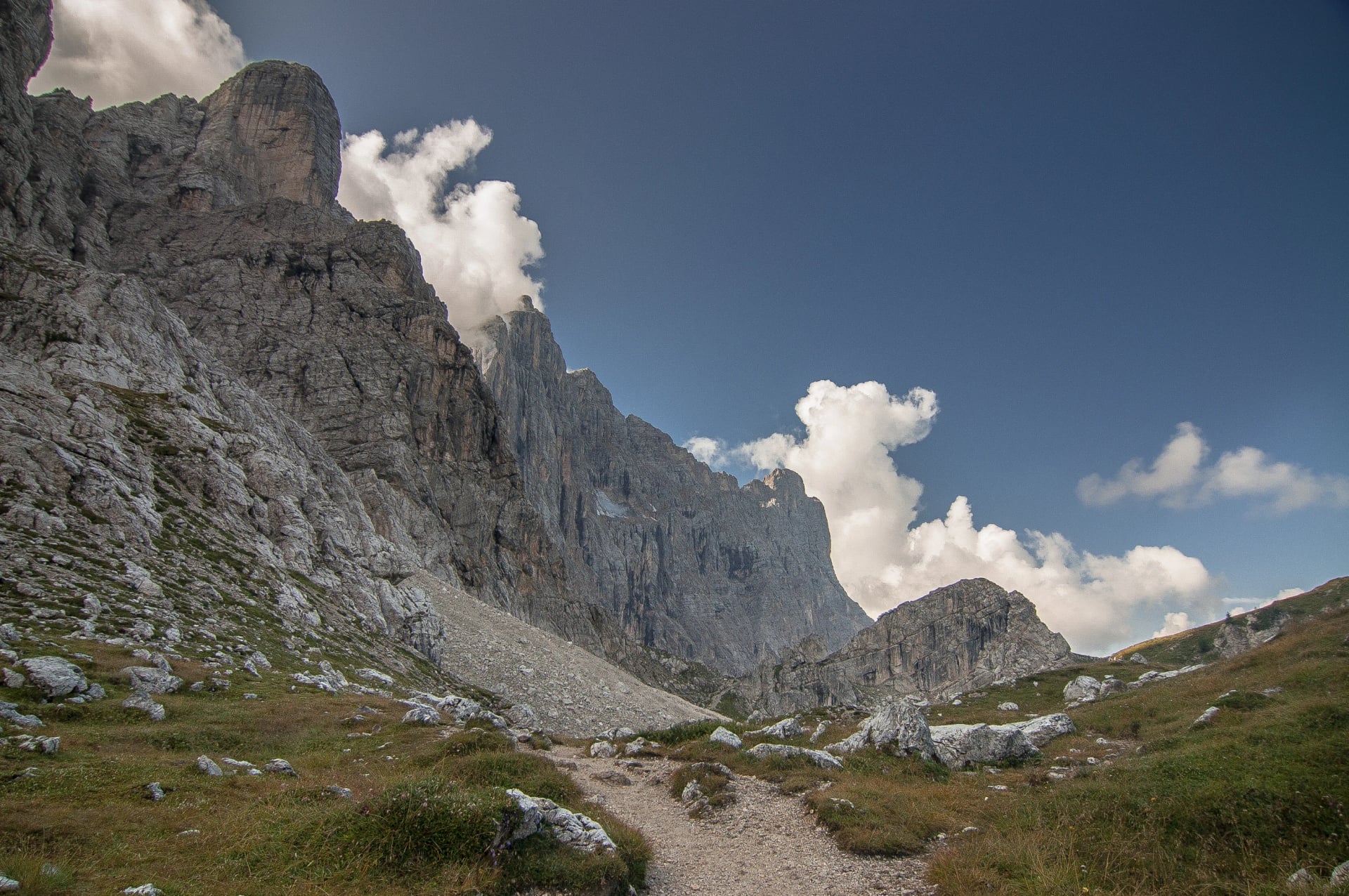 On trail from Coldai refuge via Coldai lake to Vazzoler refuge, along Civetta mountain range from north to south, stage 9 of Alta Via 1 classic long trek in the Dolomites, South Tirol, Italy.