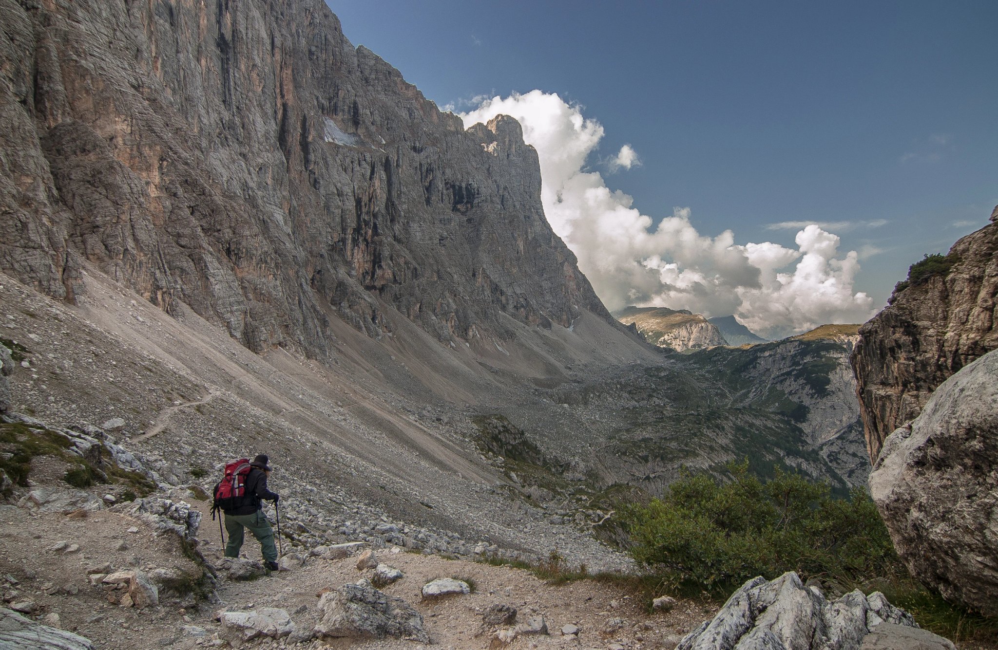 On trail from Coldai refuge via Coldai lake to Vazzoler refuge, along Civetta mountain range from north to south, stage 9 of Alta Via 1 classic long trek in the Dolomites, South Tirol, Italy.