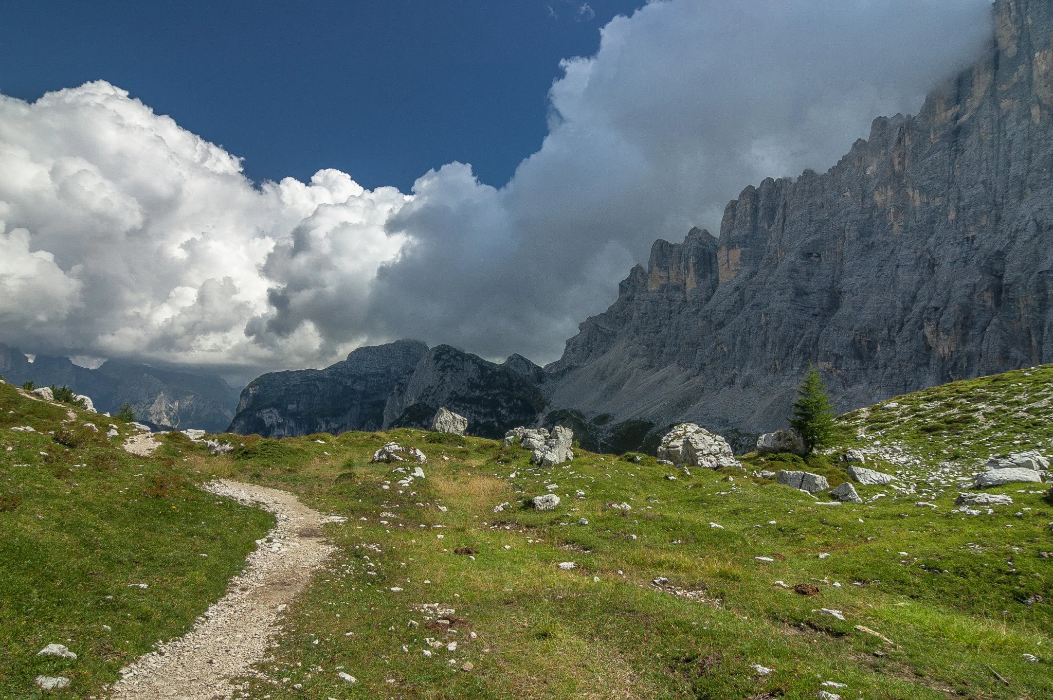 On trail from Coldai refuge via Coldai lake to Vazzoler refuge, along Civetta mountain range from north to south, stage 9 of Alta Via 1 classic long trek in the Dolomites, South Tirol, Italy.