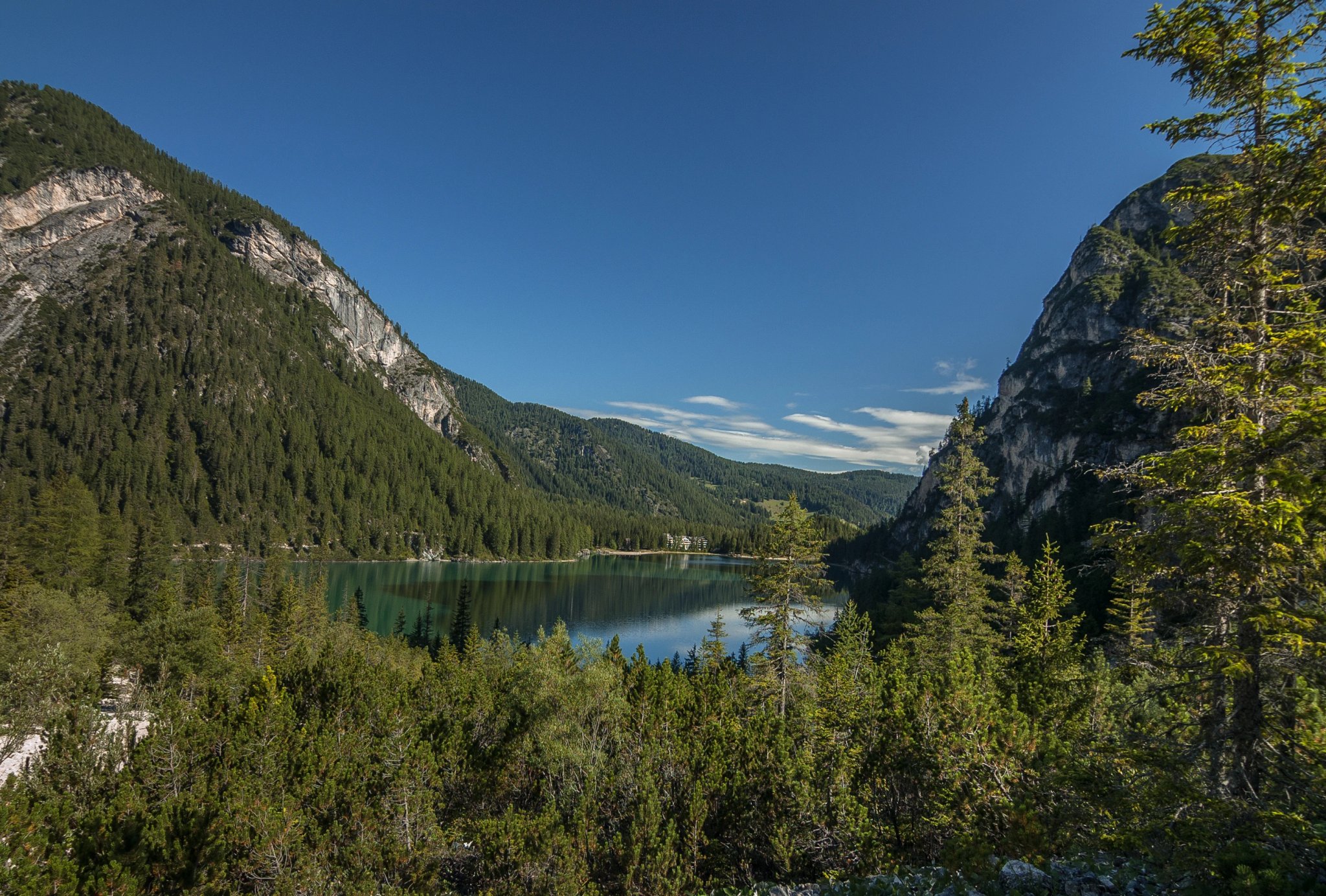 Lago di Braies, a charming, crystal clear alpine lake, located at the foot of Croda del Becco mountain, Alta Via 1 trek starting point, Prags Dolomites, Trentino-Alto Adige, South Tirol, Italy.
