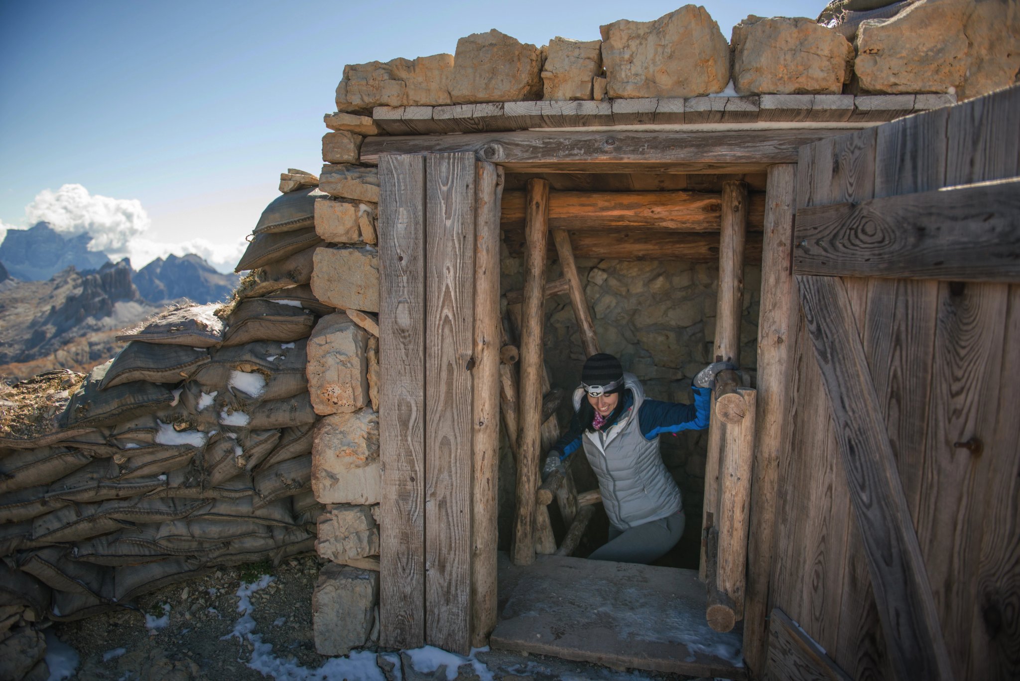 pretty young woman watching the beauty of nature in south tyrol, passo falzarego, italien dolomites