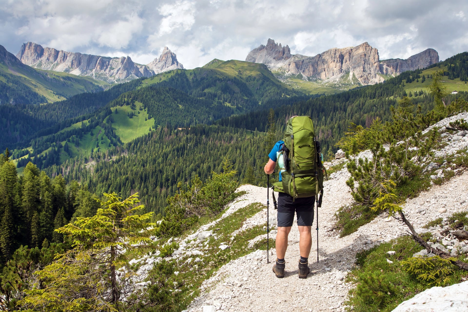 Group of hikers and Alps Dolomites mountains, Italy