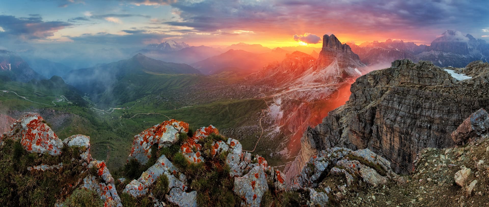 Panorama dramatic sunset in dolomites alp mountain from peak Nuvolau
