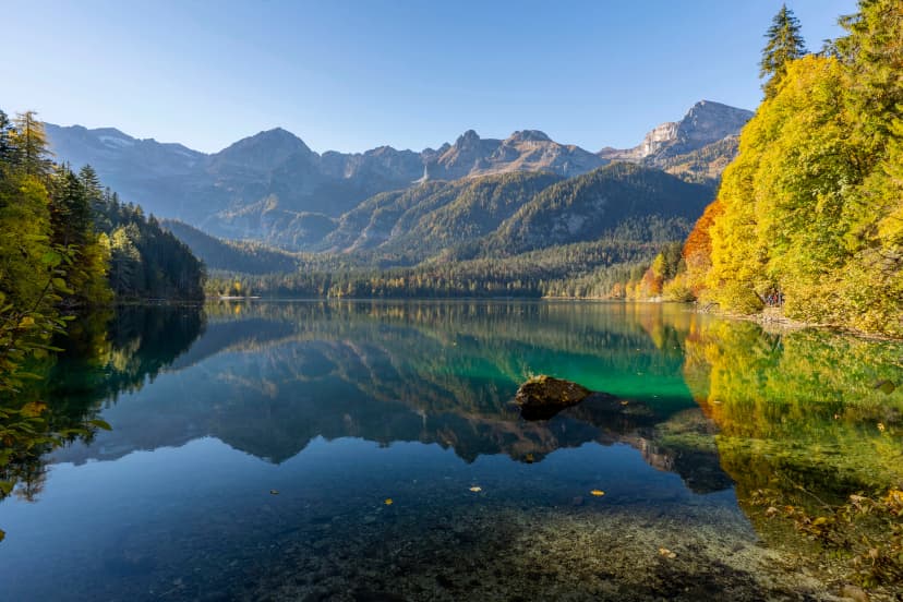 Italy, Trentino, Lago di Tovel - 24 October 2021 - A glimpse of Lake Tovel with its autumn-colored trees