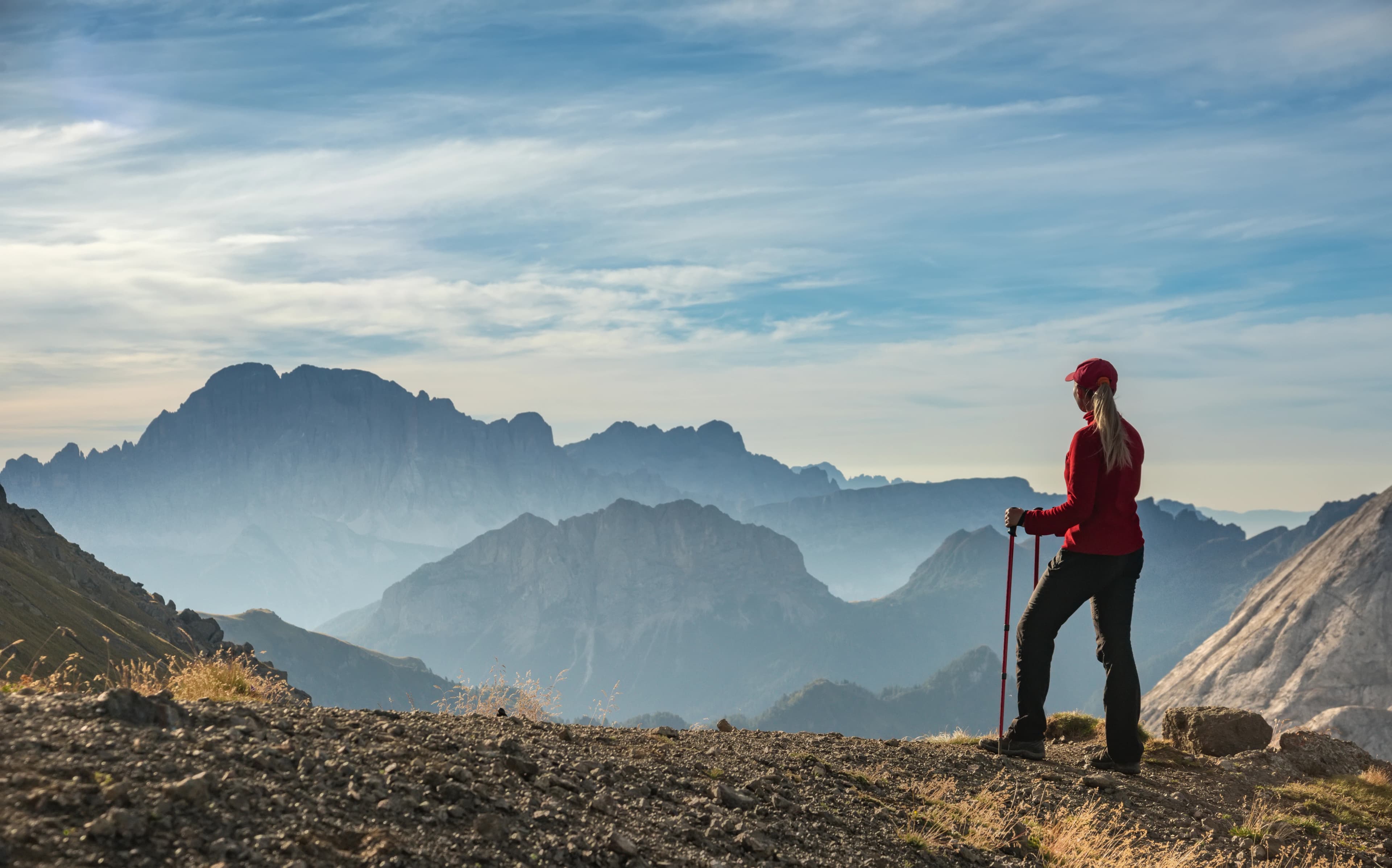 Sporty Young woman on mountain trail Dolomites Mountains, Italy