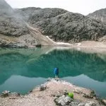 hiker at the lake antermoia