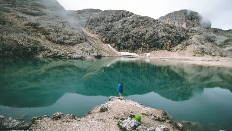 hiker at the lake antermoia