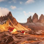 Incredible sunset at the Tre Cime di Lavaredo and rifugio Locatelli in Dolomite Alps. Three peaks of Lavaredo, Dolomites, South Tyrol, Italy, Europe. Landscape photography panorama